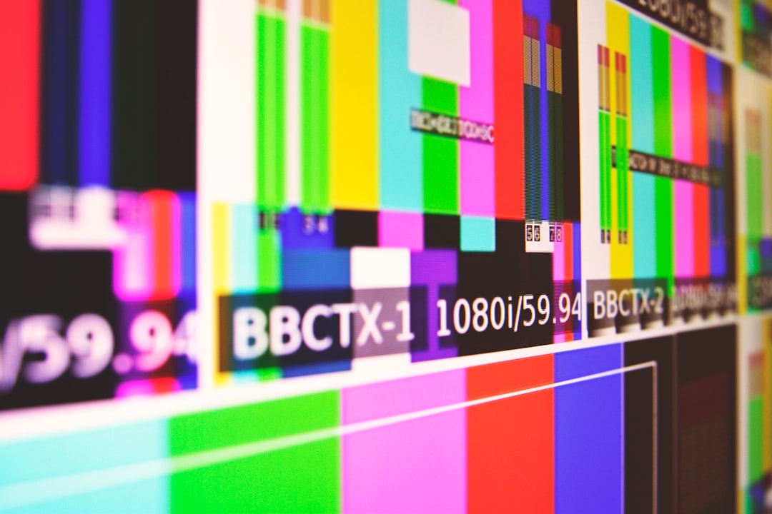 Television broadcast color bar test patterns showing multiple TV display panels side by side