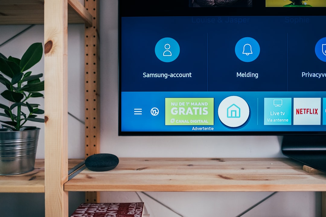 Samsung smart TV showing the Samsung account and app menu UI on screen