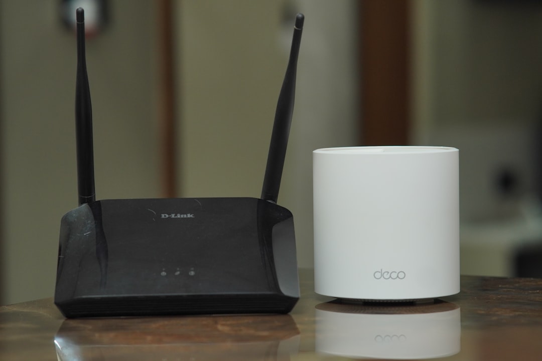 Traditional D-Link Wi-Fi router next to a modern TP-Link mesh router on a table