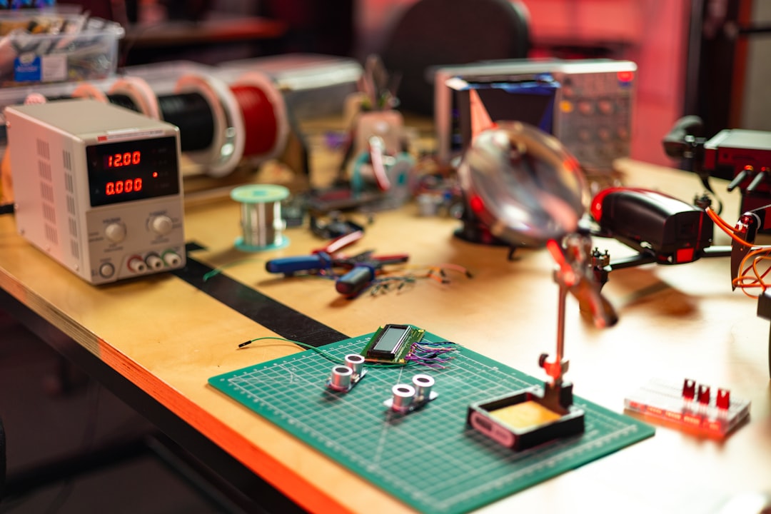 Electronics repair workbench with tools, components, and testing equipment for same-day TV repair service